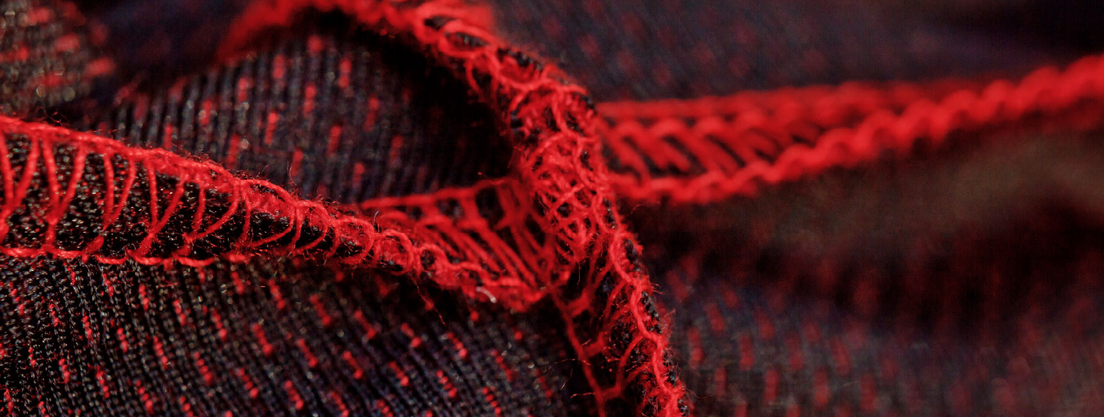 Close up of black and red fabric and thread